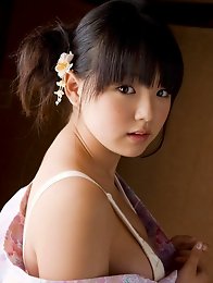 Asian babe shows of massive tits as she takes off her kimono