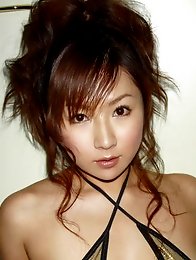 Delectable grauvre idol beauty seduces in her purple bikini