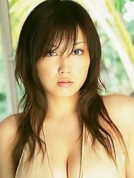 Sensual gravure idol babe seduces in skimpy cream lingerie