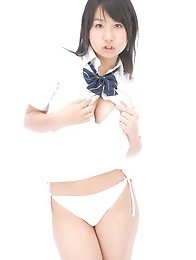Adorable busty asian school girl lifts up her plaid skirt