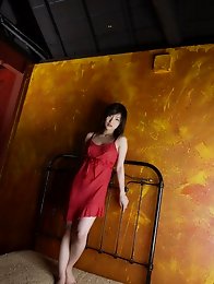 Enchanting Rei Amami takes off her red dress and gets naked