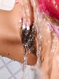 Seductive asian hottie teases with her naked busty boobs