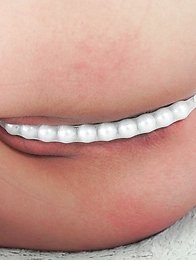 On the green screen Reina ran her hands across her see through outfit