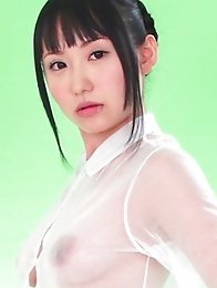 On the green screen Reina ran her hands across her see through outfit