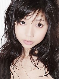 Beautiful gravure idol with milky white skin in silky lingerie