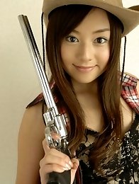 Adorable asian cowgirl tempts in her boots and jean shorts