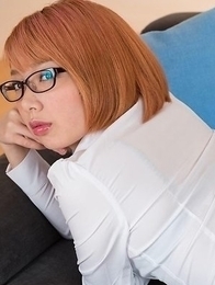 Glasses-wearing secretary Chie Kobayashi flashing her pussy on a couch