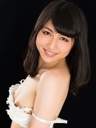 Cheerful teen Reo Saionji posing seductively in her stockings and stylish heels