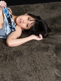 Leggy brunette Kotomi Shinosaki sucking on her finger while showing those legs