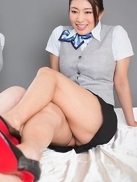 Stewardesses Reiko Kobayakawa and Ryu Enami give this guy a great footjob