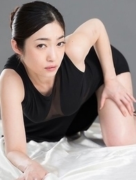 Dress-wearing classy seductress Ryu Enami using her feet to get this dude to cum