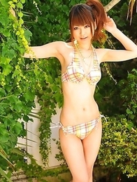 Asian girls pose in bikinis outside