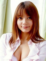 Tina Yuzuki is holding flowers in front her hairy pussy