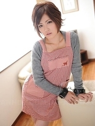 Kaede Oshiro with busy mouth shows sexy legs