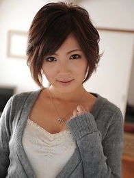 Kaede Oshiro with busy mouth shows sexy legs