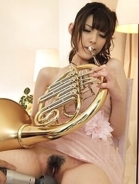 A fan fucks Kanako Iioka with his fingers while playing the horn