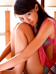 Akina Minami in colorful bath suits plays with big ball