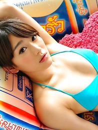 Shou Nishino in blue bath suit sits with ass up in the air