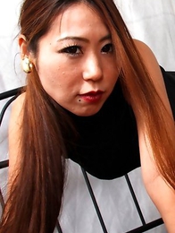 Miho Kuroki shows sexy legs under black dress in her bed