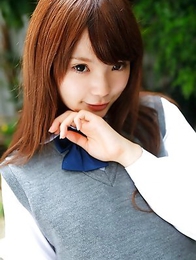 Manami Sato in short uniform skirt spends time in the park