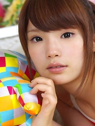 Manami Sato with sexy curves in bath suit plays with pillow