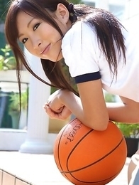 Ayaka Enomoto in sports outfit plays with ball outdoor