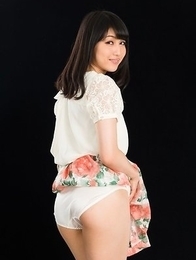 Cheerful teen Reo Saionji posing seductively in her stockings and stylish heels